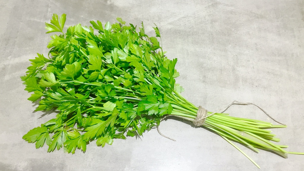 a bunch of parsley on the table