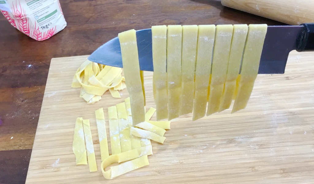 chopped pasta on the knife
