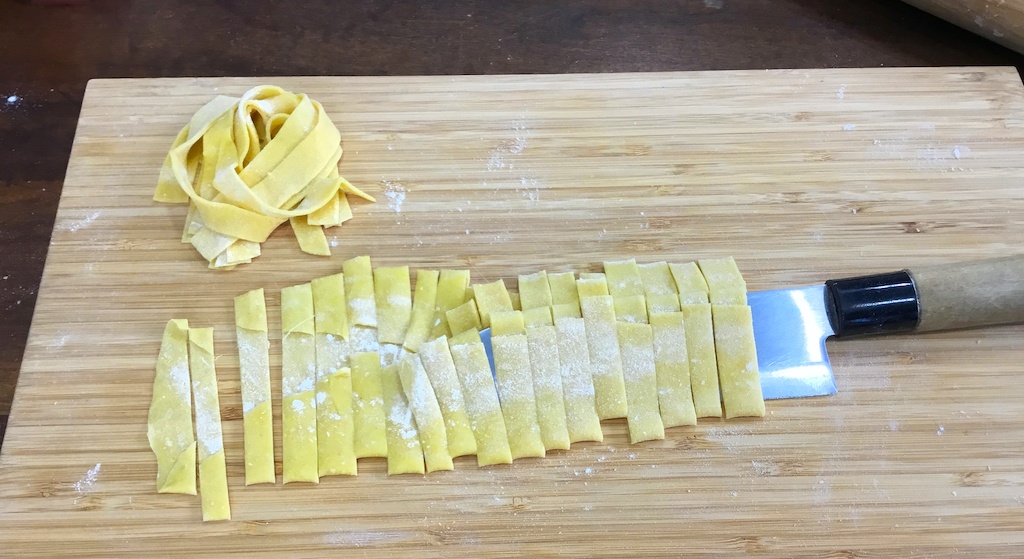 chopped pasta with the knife underneath