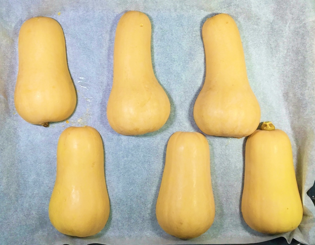 butternut squash upside on the baking parchment