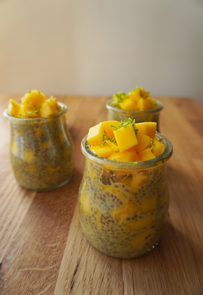 mango chia seeds pudding in glass containers on wooden worktop