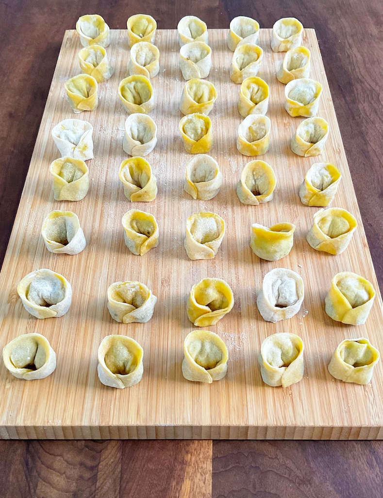 mushroom dumplings lined on a board