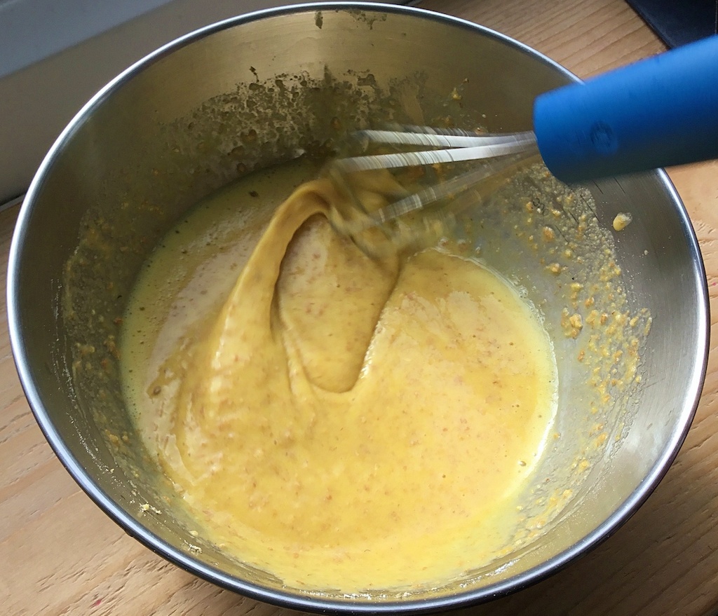 batter for nettle crisps in a mixing bowl with a whisk