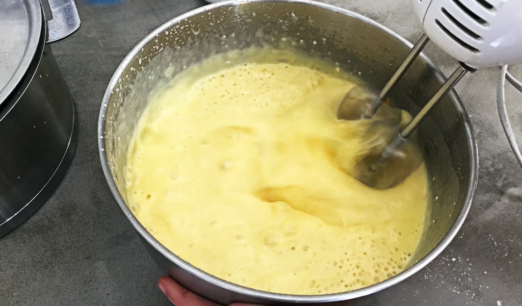 batter whisked in a bowl with an electric mixer