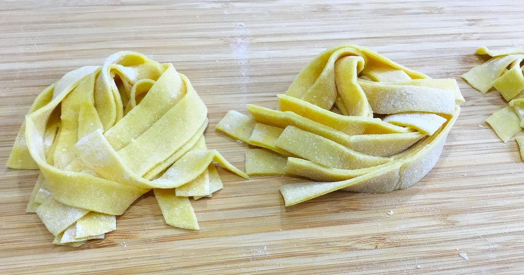 pappardelle pasta arranged in rings on the chopping board