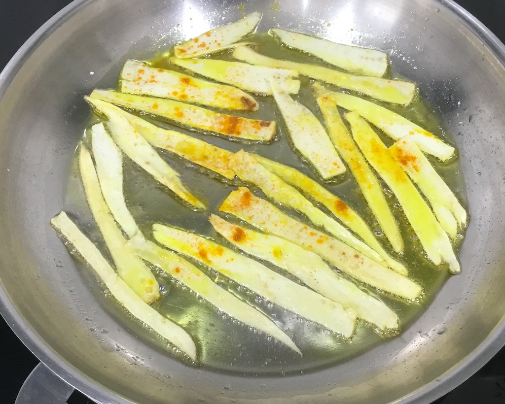 parsnip peel crisps on the frying pan