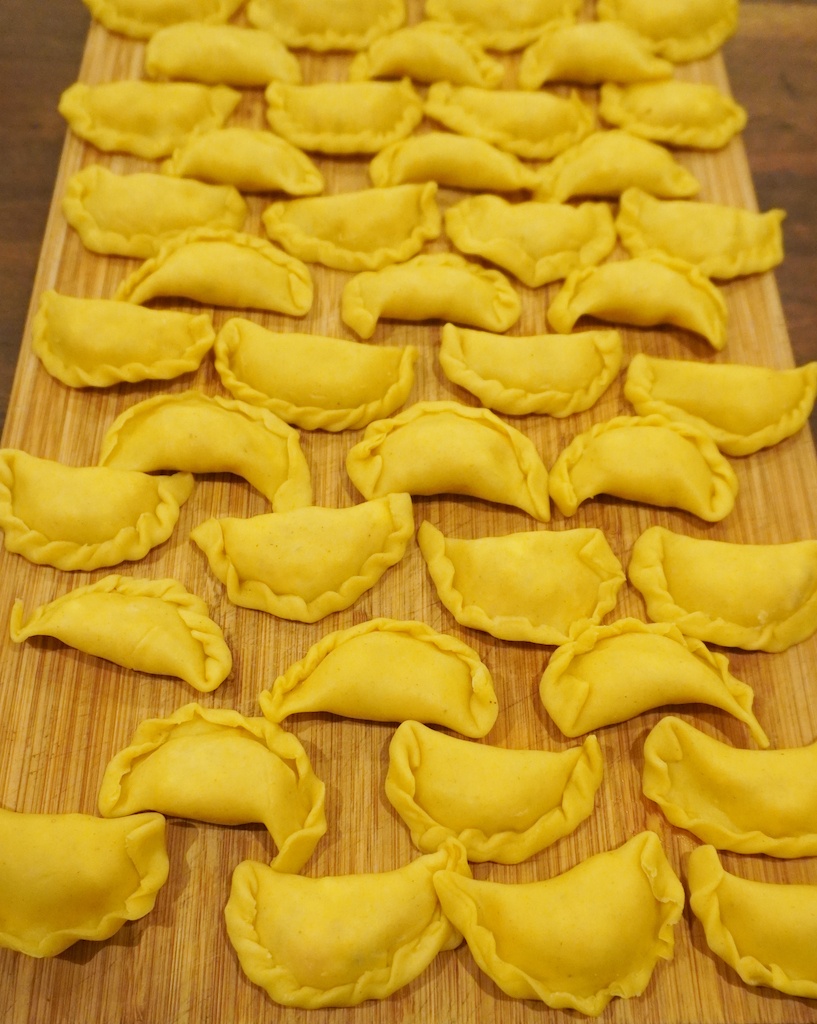 pierogi dumplings on the board ready to cook