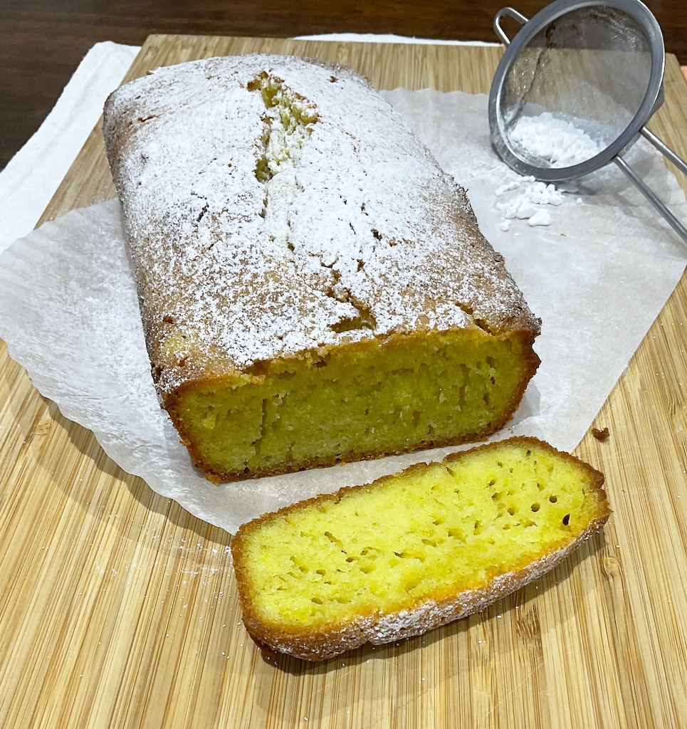 pound cake with one one slice cut off on the board