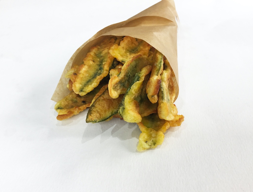 sage leaves in beer batter in a paper cone