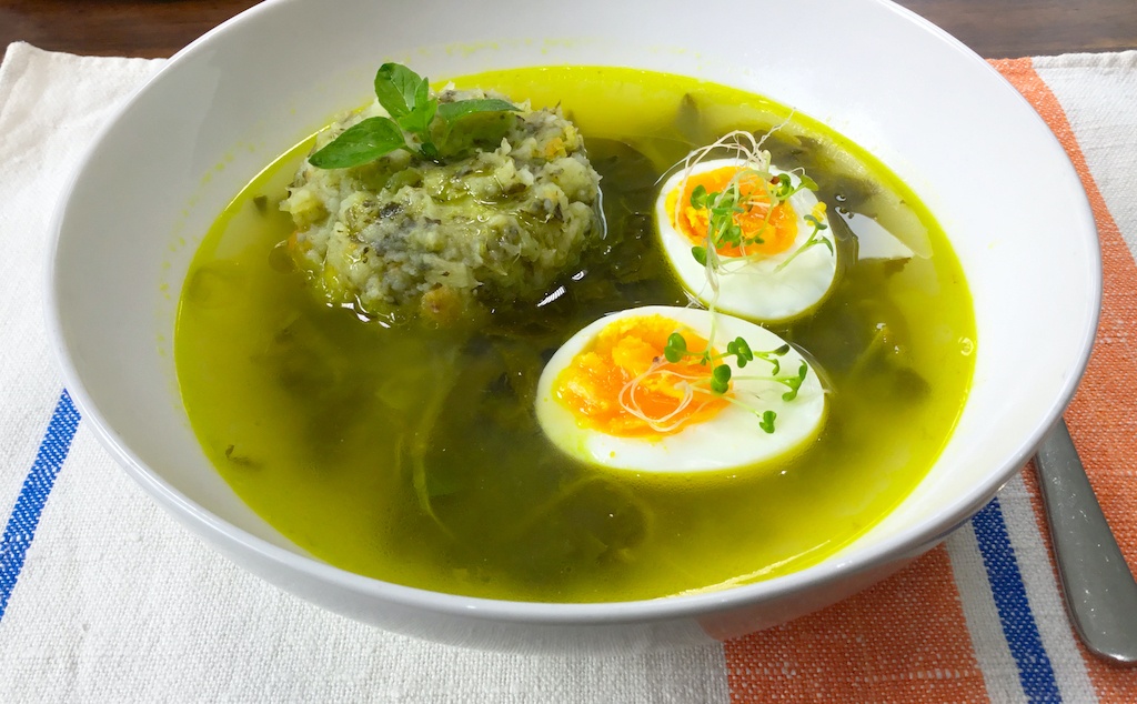 sorrel soup with veg puree and egg on the plate