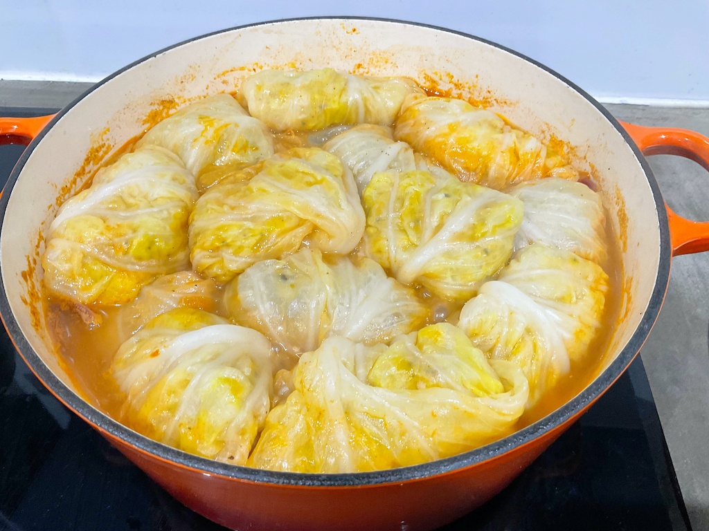 stuffed cabbage leaves or rolls in cast iron pan