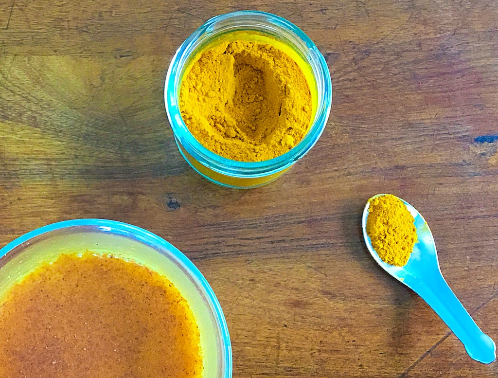 turmeric latte and the powder in a jar from the top