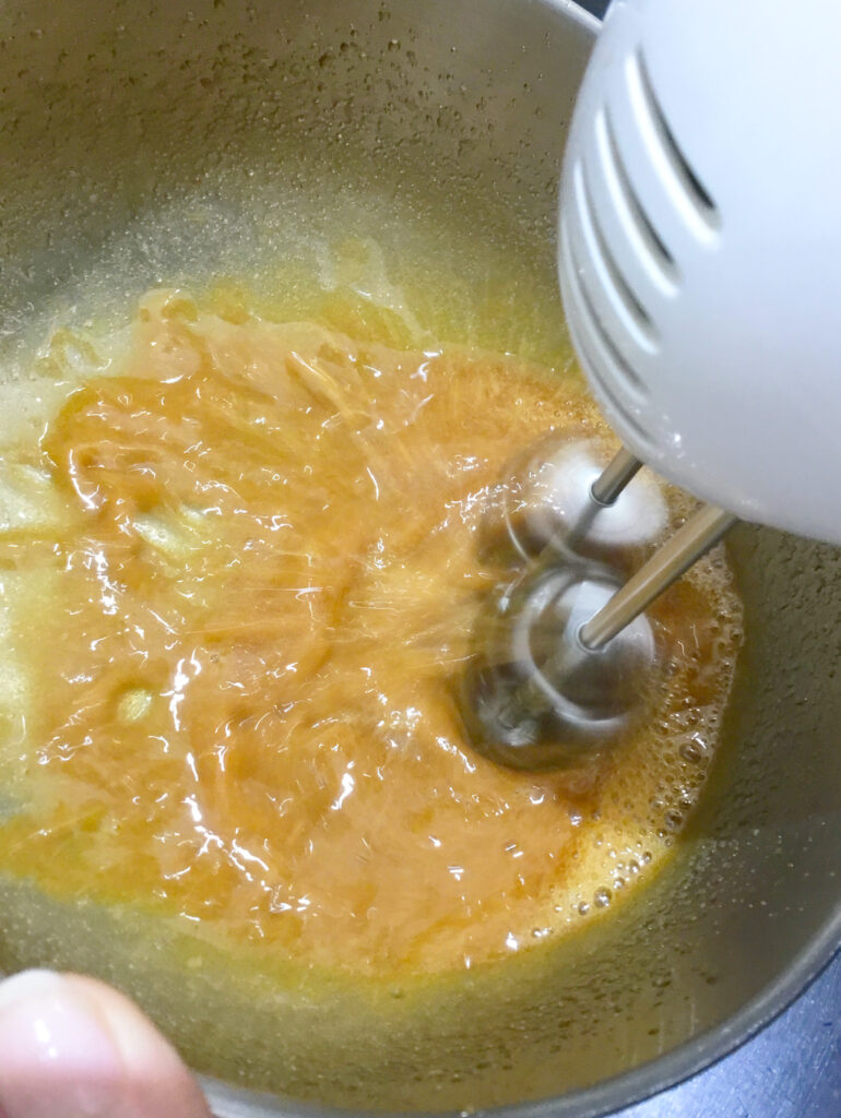 whipping of dalgona coffee in the mixing bowl