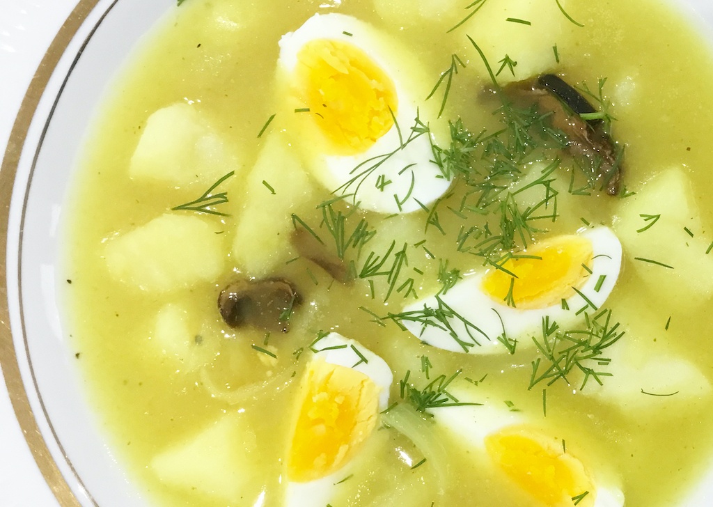 white borscht on the plate - a close up seen from the top